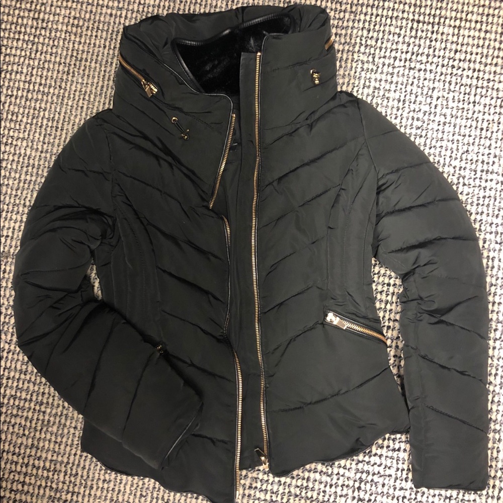 Gold zippers. Hood hidden in collar. Never worn.